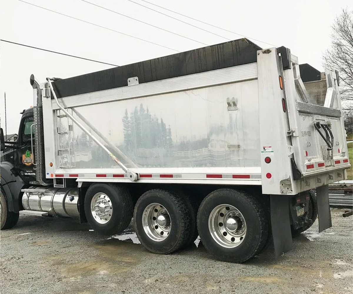Heavy-duty farm equipment dump truck with custom welded body
